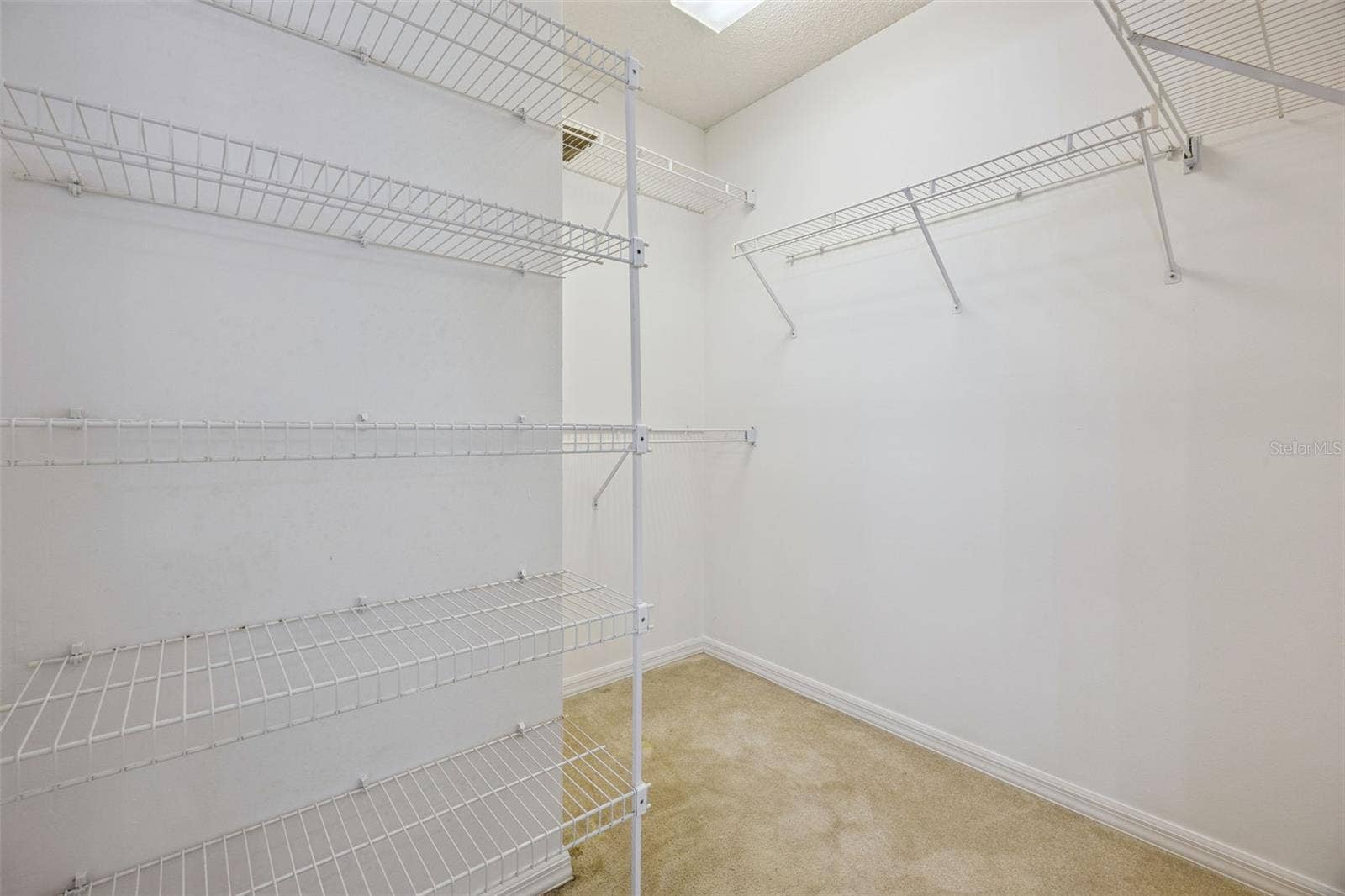 8370 SANDPOINT BLVD, Orlando, FL 32819 Primary walk in closet