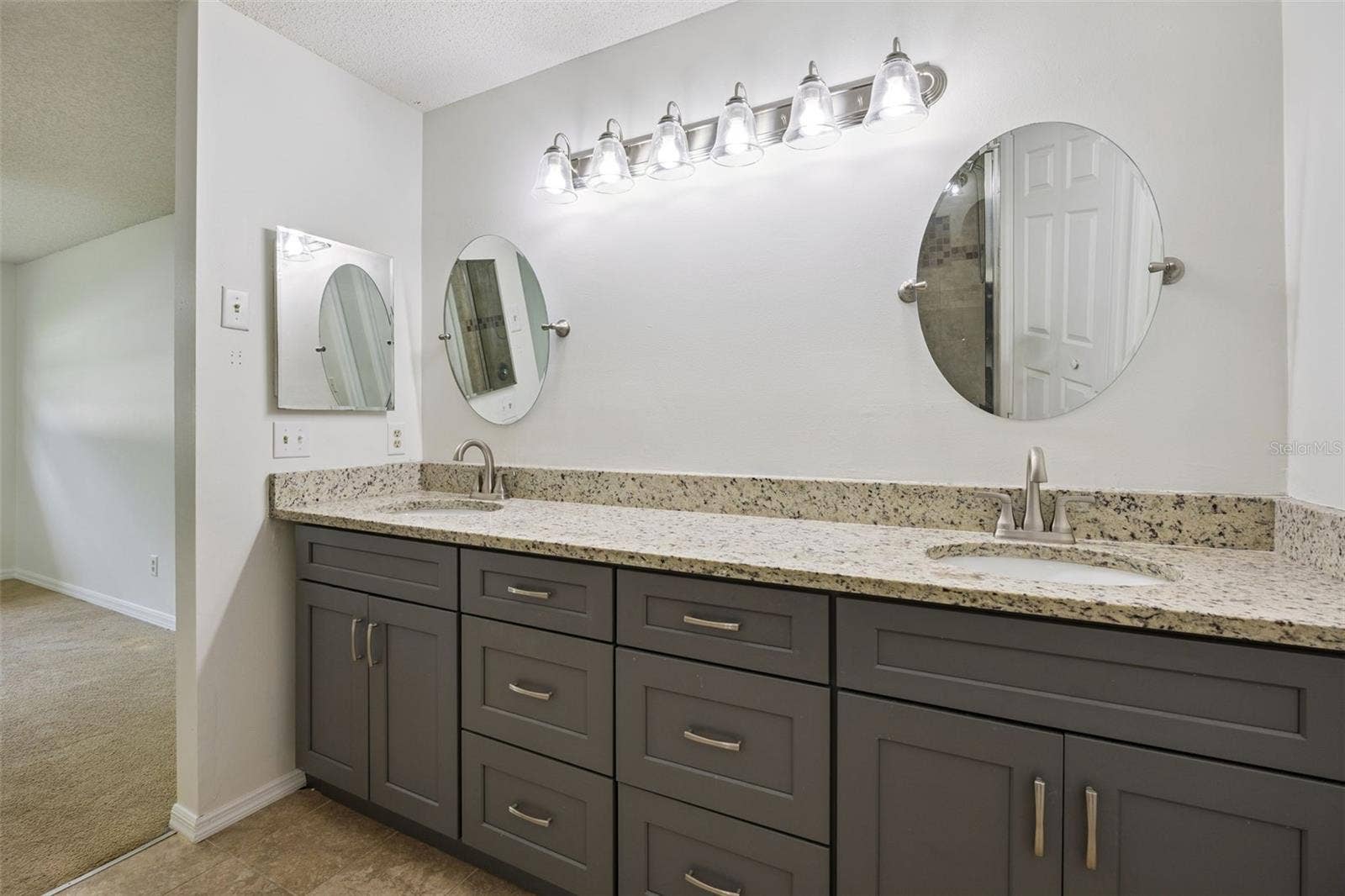 8370 SANDPOINT BLVD, Orlando, FL 32819 Primary bedroom Dual sink/vanity