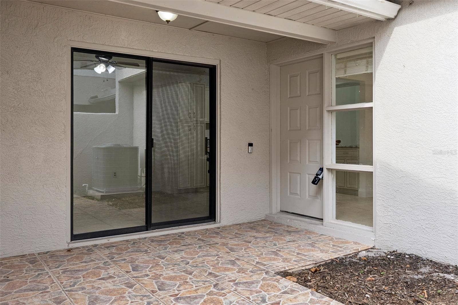 8370 SANDPOINT BLVD, Orlando, FL 32819 Private entryway with access to kitchen/kitchen nook