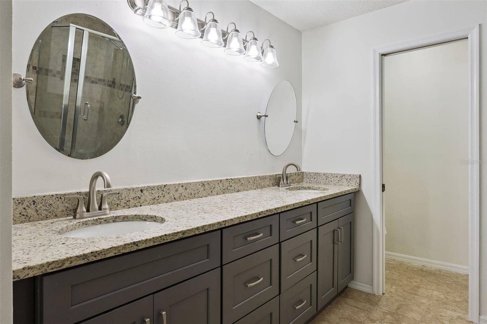 8370 SANDPOINT BLVD, Orlando, FL 32819 Primary bedroom Dual sink/vanity