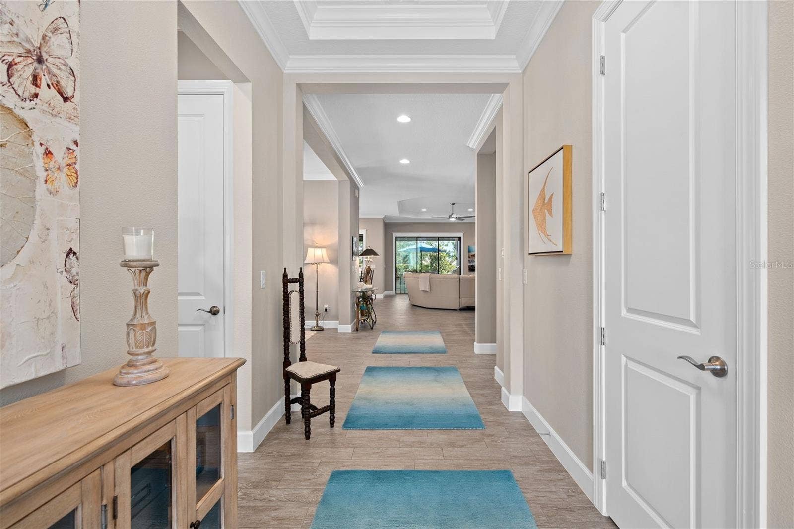 1279 ZEEK RIDGE STREET, Clermont, FL 34715 Upon entry you will be greeted by a see through floor plan offering 10' ceilings with tray's and crown molding.