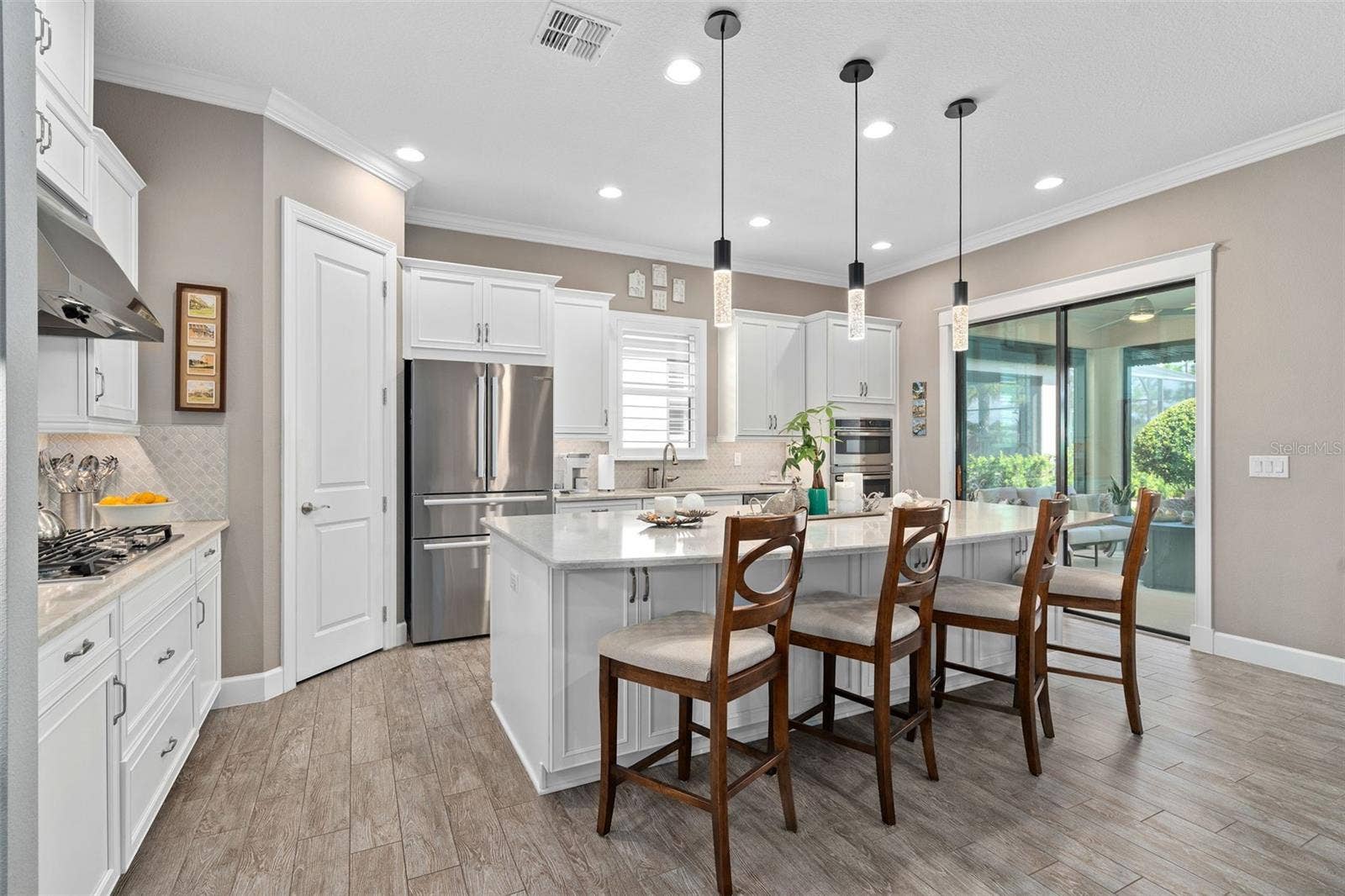 1279 ZEEK RIDGE STREET, Clermont, FL 34715 Under cabinet lighting grace the Quartz Countertops and the ceramic backsplash.