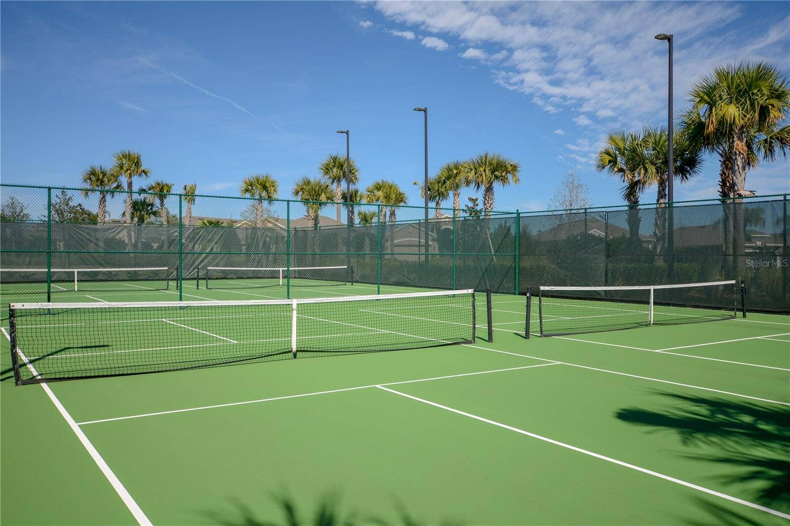 1279 ZEEK RIDGE STREET, Clermont, FL 34715 4 Pickle Ball Courts for your playing enjoyment. The Courts are lighted for nighttime play.