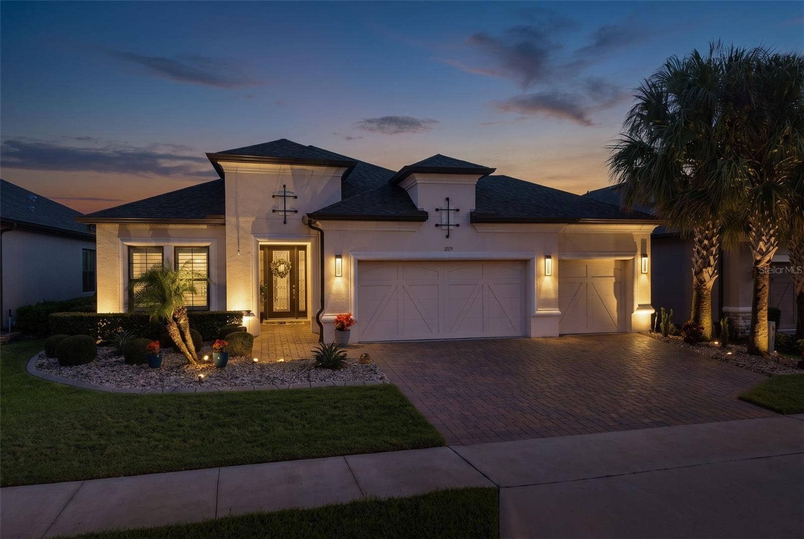 1279 ZEEK RIDGE STREET, Clermont, FL 34715 Beautiful curb appeal is accentuated with landscape lighting.