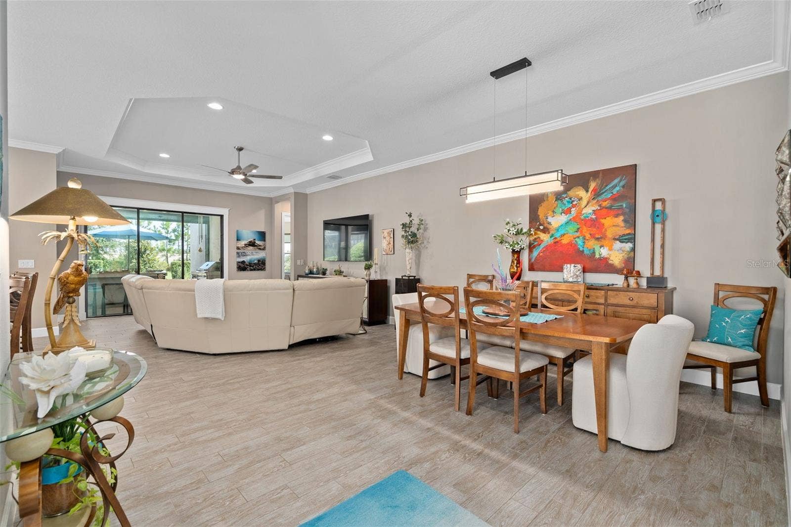 1279 ZEEK RIDGE STREET, Clermont, FL 34715 Dining room / Great room view. The 10' ceilings in addition to the tray's and crown molding add another dimension.