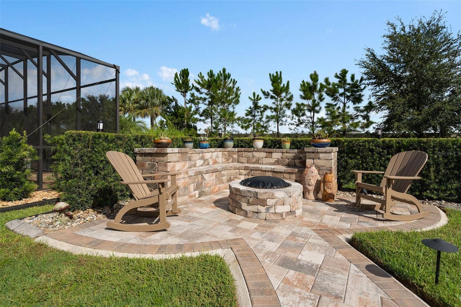 1279 ZEEK RIDGE STREET, Clermont, FL 34715 Gather around the fire pit and sip on your favorite beverage.