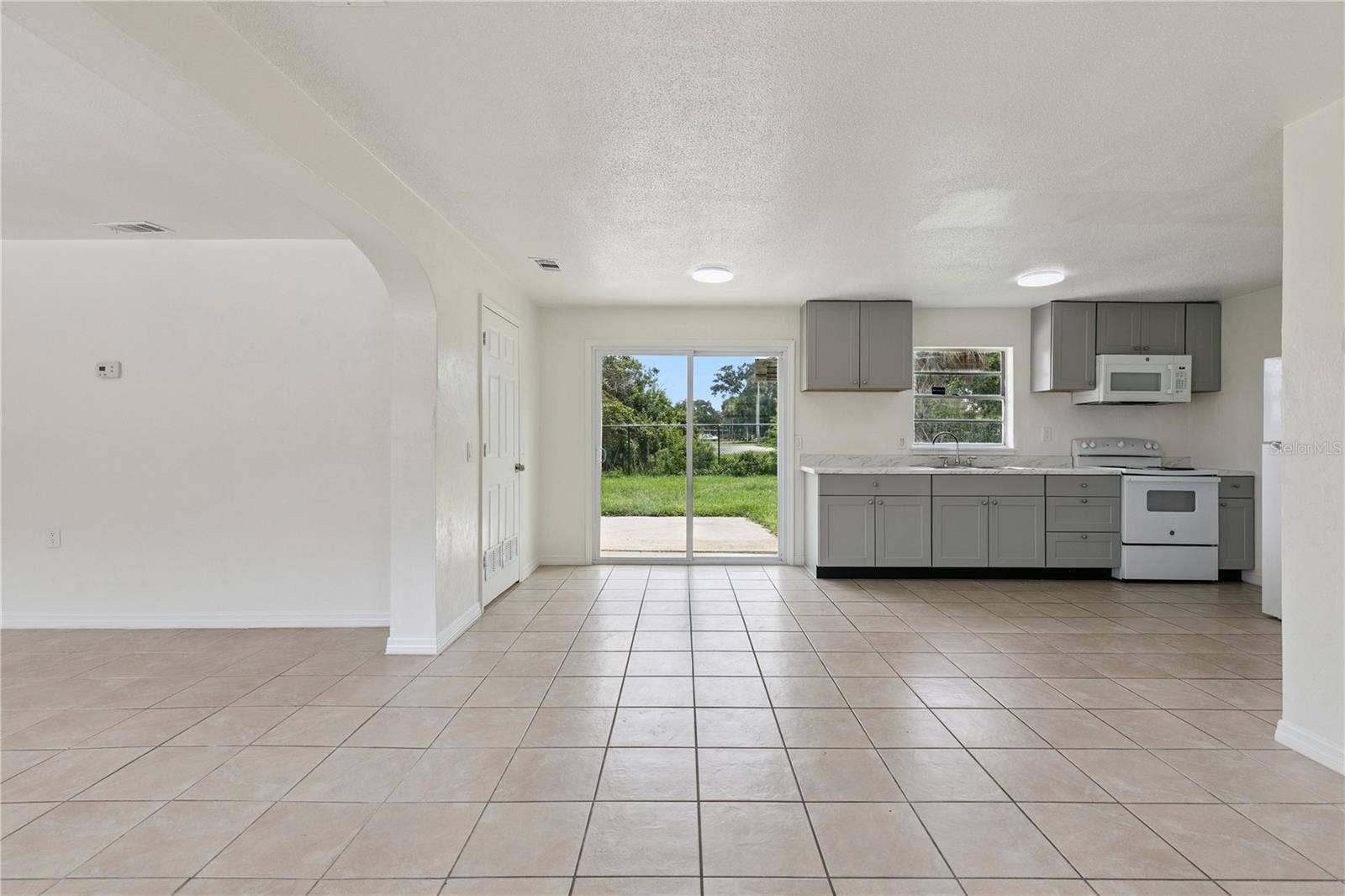 875 LOOMIS AVENUE, Daytona Beach, FL 32114 Open Floor Plan Kitchen with Natural Lighting