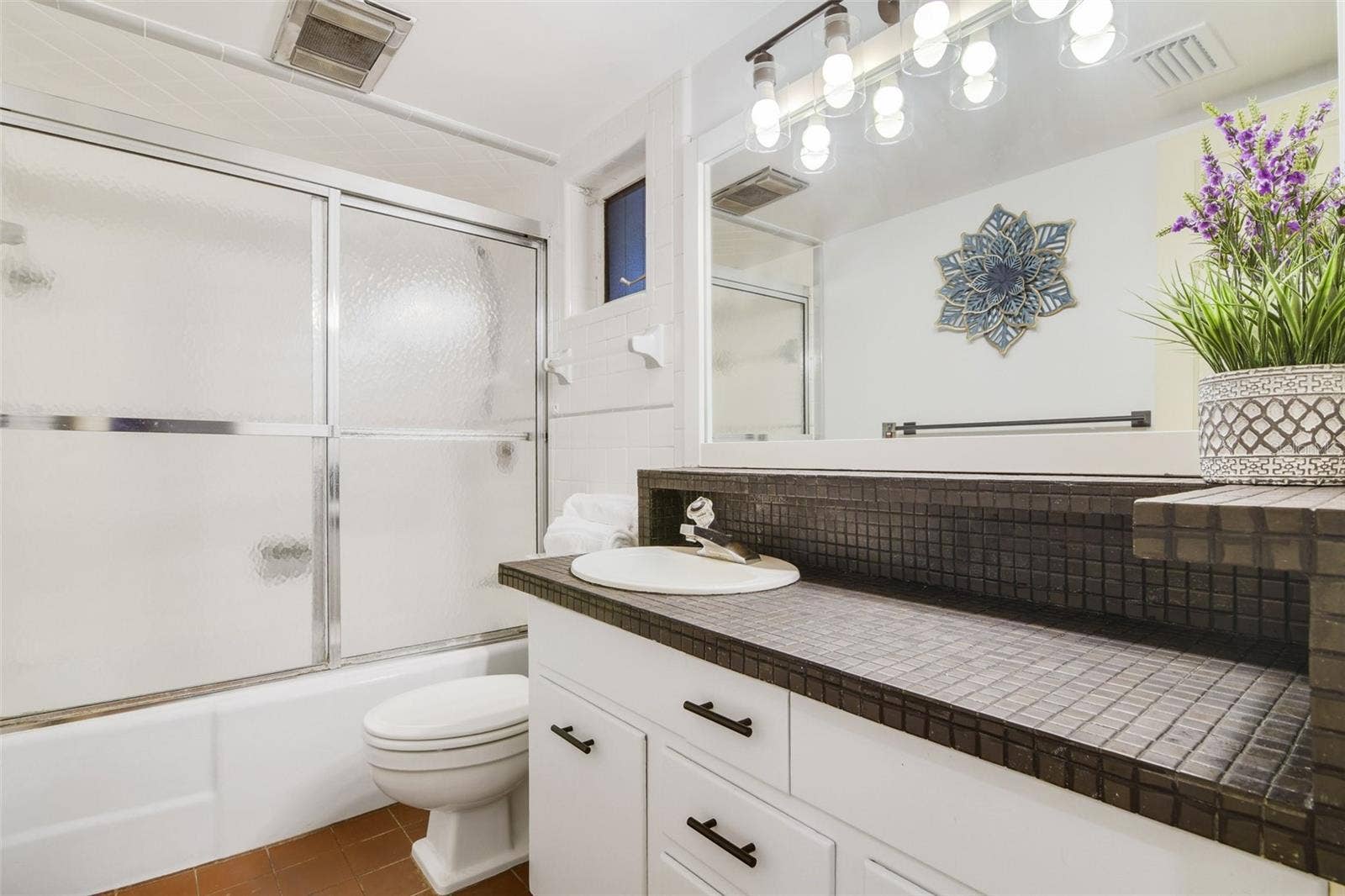 Pool bathroom with shower and tub