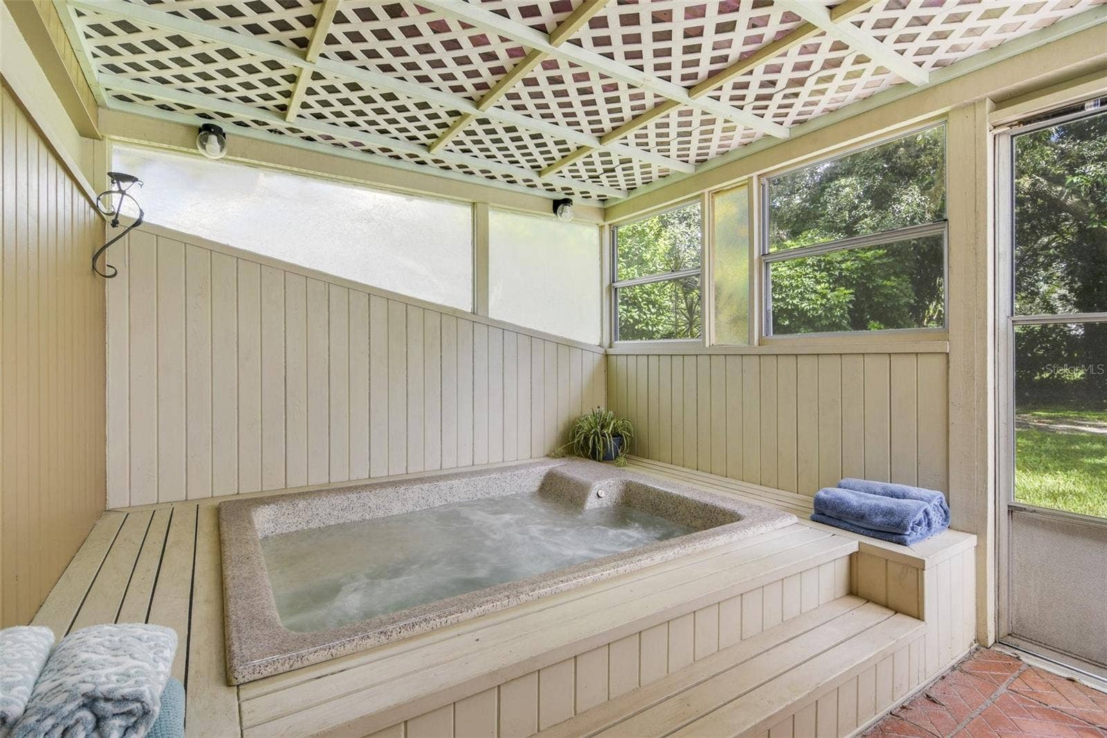 Hot tub outside of primary bedroom