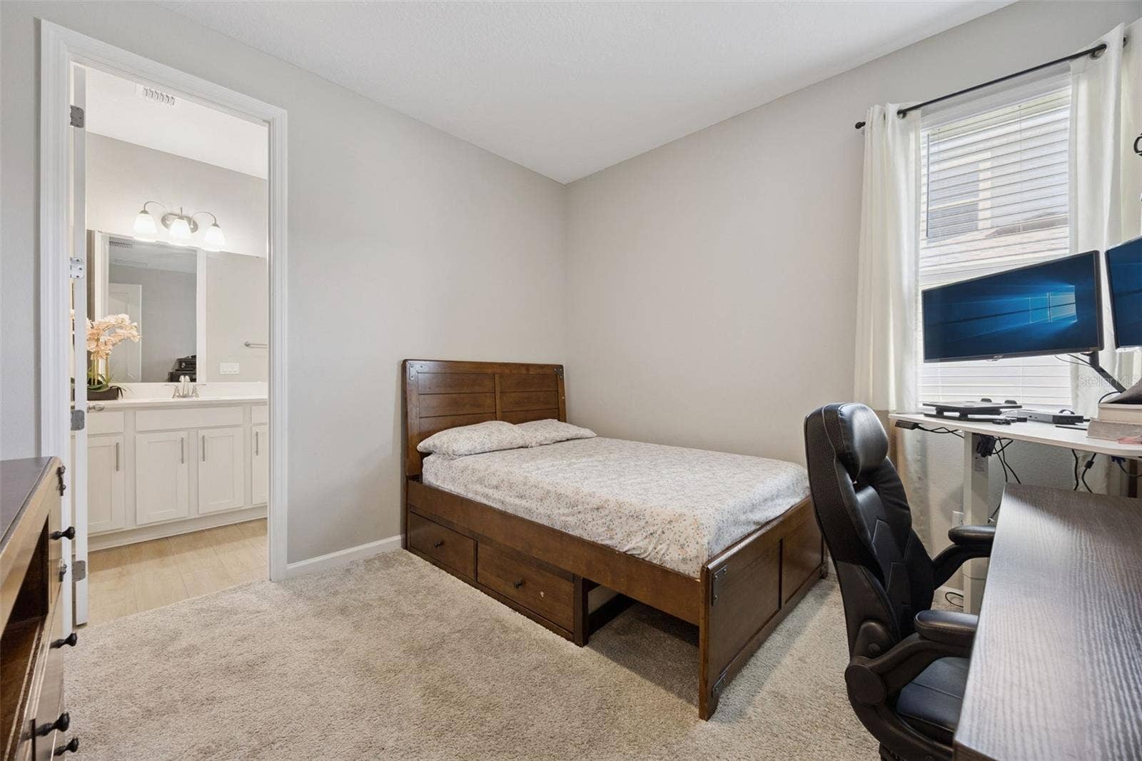 10053 SPRING LAKE DRIVE, Clermont, FL 34711 Bedroom with ensuite bathroom