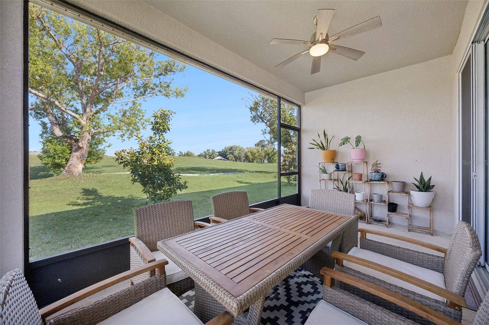 10053 SPRING LAKE DRIVE, Clermont, FL 34711 Back porch overlooking a peaceful, private setting.
