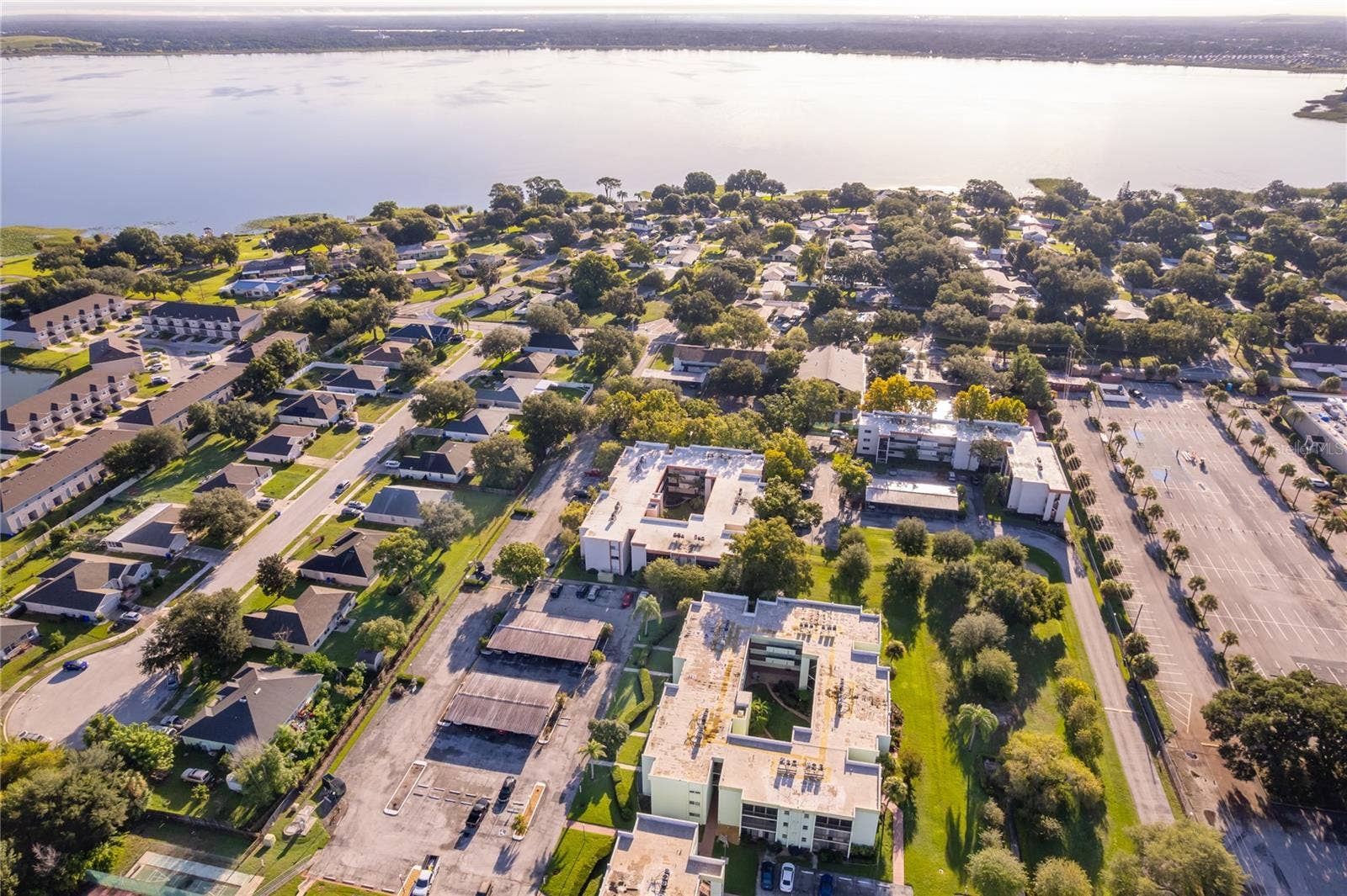1130 N LAKE PARKER AVENUE, #C126, Lakeland, FL 33805 Aerial View of Community and Lake