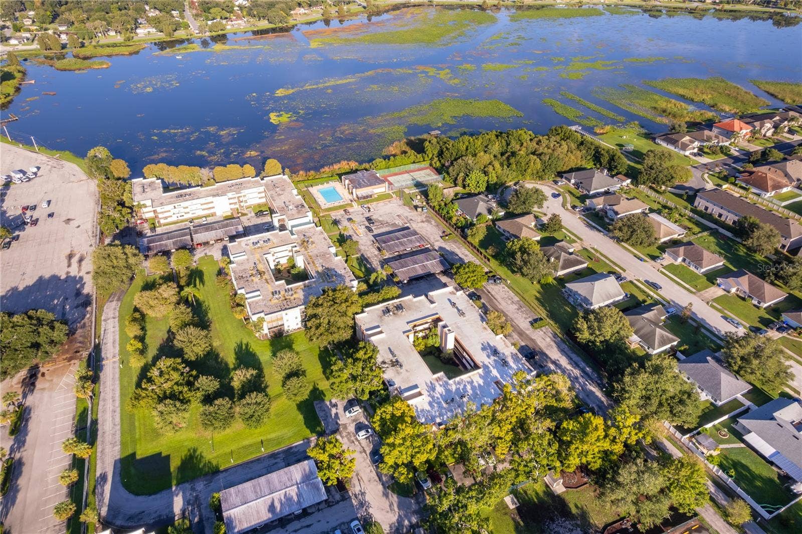 1130 N LAKE PARKER AVENUE, #C126, Lakeland, FL 33805 Aerial View of Community and Lake