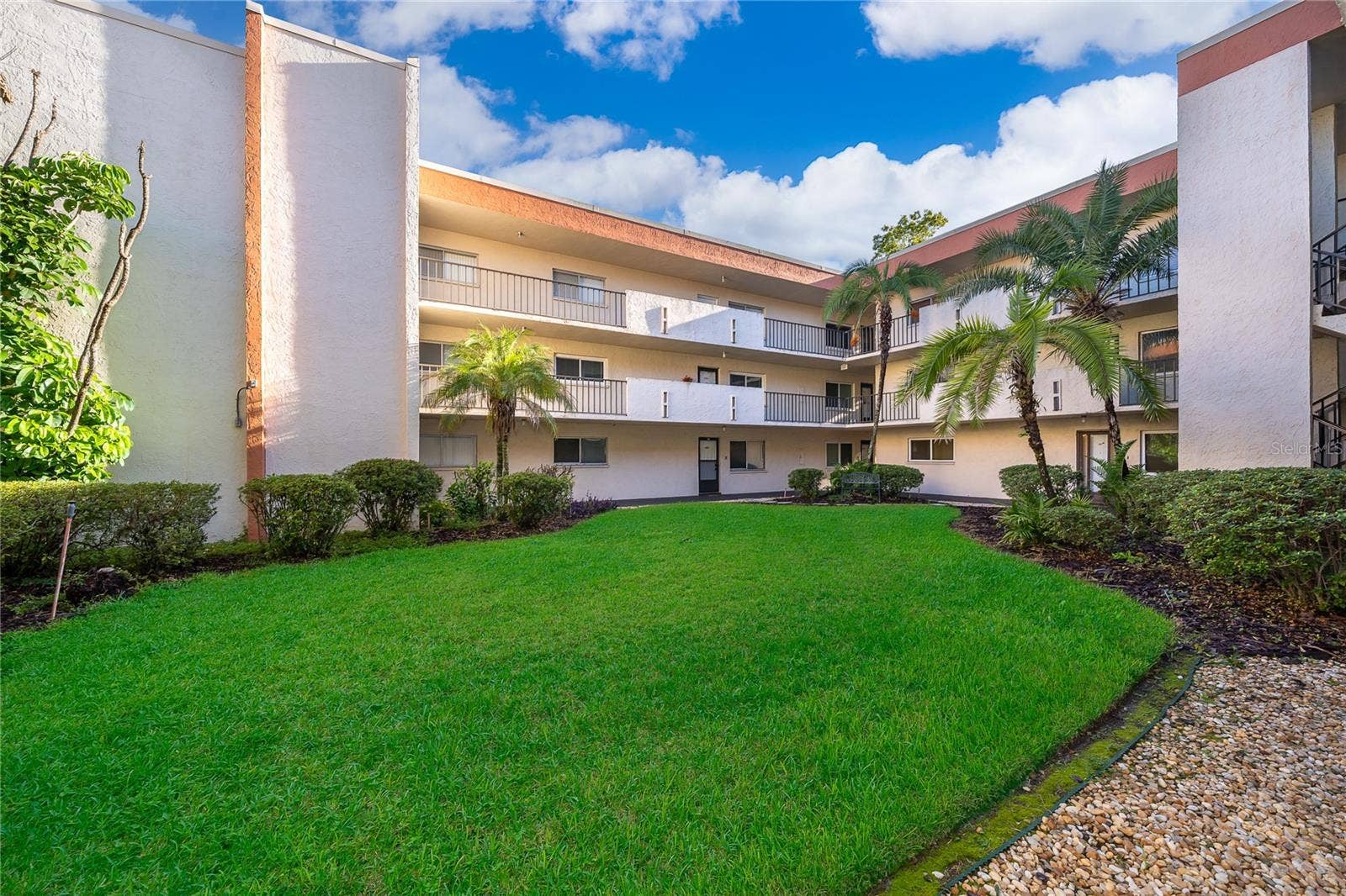 1130 N LAKE PARKER AVENUE, #C126, Lakeland, FL 33805 Court Yard View of Building.
