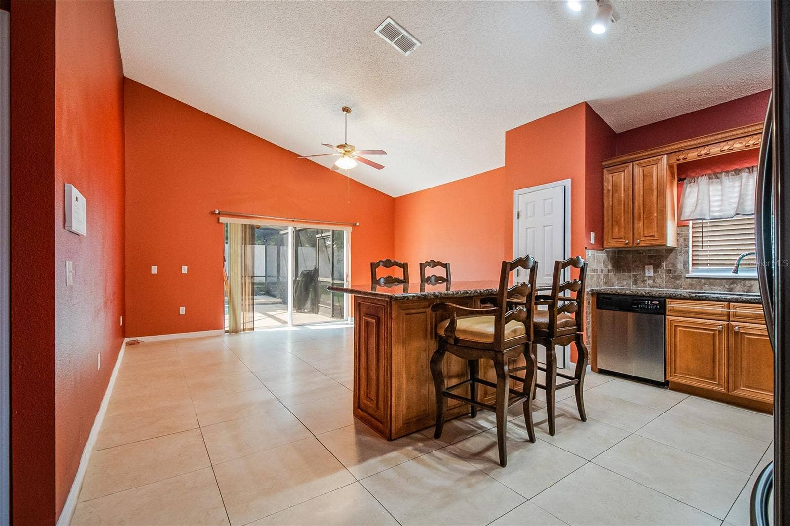 2753 WOODSTREAM CIRCLE, Kissimmee, FL 34743 Kitchen with breakfast bar seating