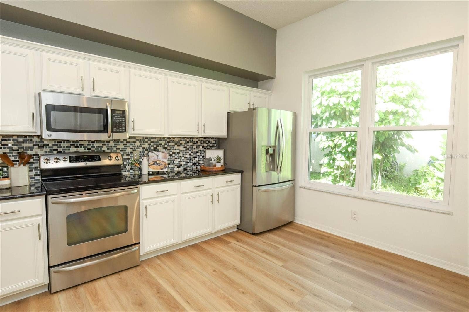 Kitchen with Stainless Steel Appliances & Large Window