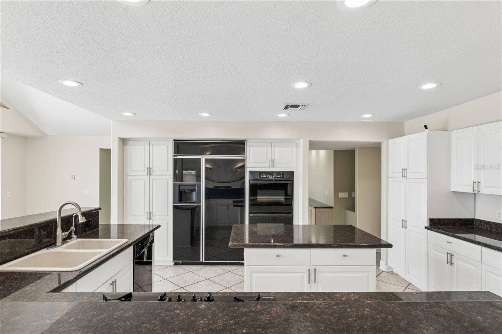 4301 DOWN POINT LANE, Windermere, FL 34786 Spacious kitchen with abundant cabinetry, center island, and generous prep space for everyday living and entertaining.