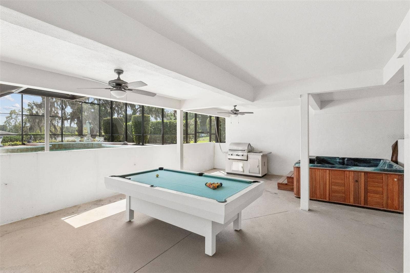 4301 DOWN POINT LANE, Windermere, FL 34786 Covered lower-level entertainment area.