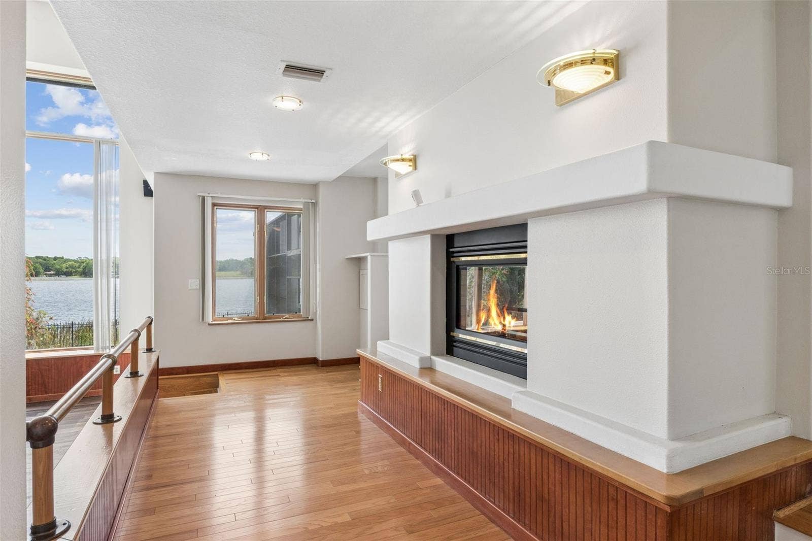 4301 DOWN POINT LANE, Windermere, FL 34786 Loft overlook with fireplace and lake views