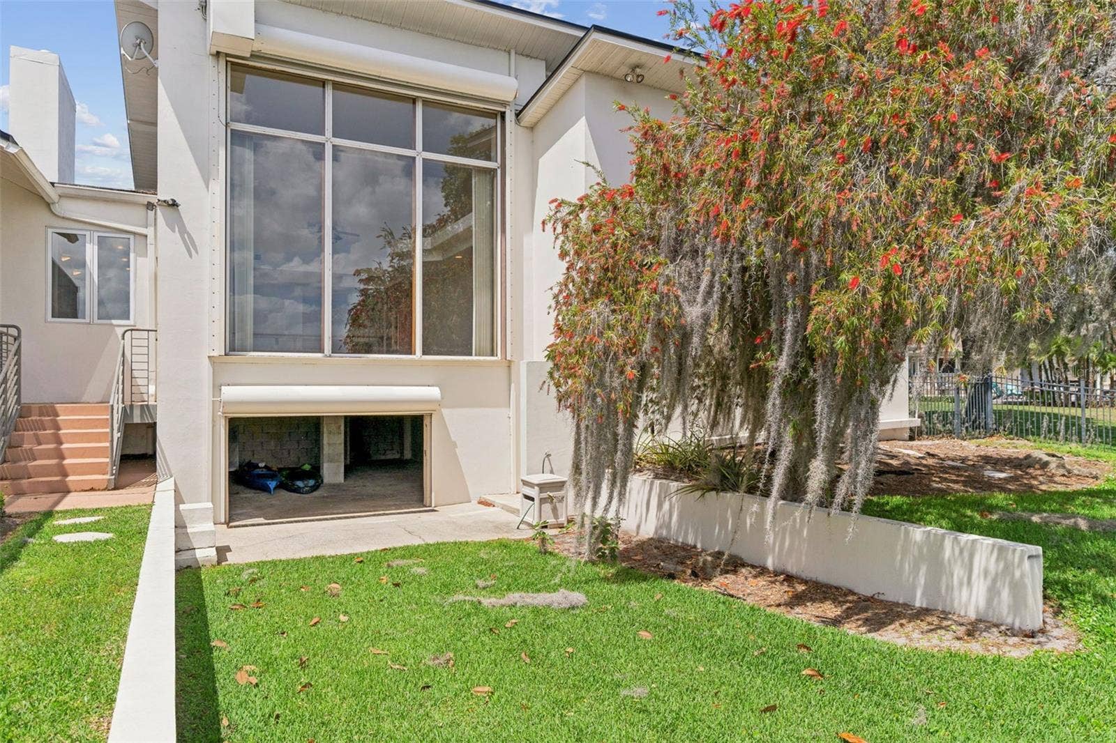 4301 DOWN POINT LANE, Windermere, FL 34786 Lower-level garage space for boat gear, kayaks, paddle boards, trailers, and lakefront equipment.