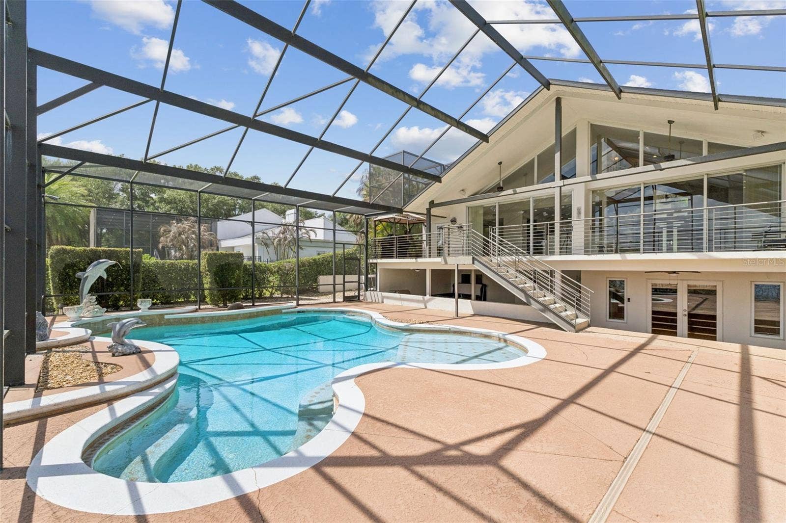4301 DOWN POINT LANE, Windermere, FL 34786 Screened pool, covered entertaining area.