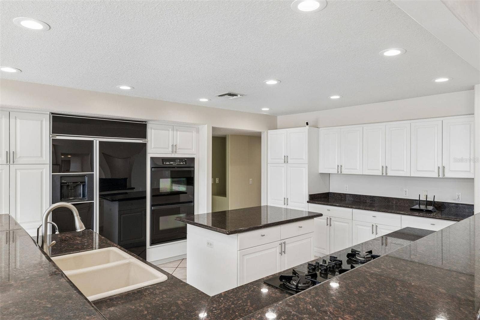 4301 DOWN POINT LANE, Windermere, FL 34786 Spacious kitchen with abundant cabinetry, center island, and generous prep space for everyday living and entertaining.