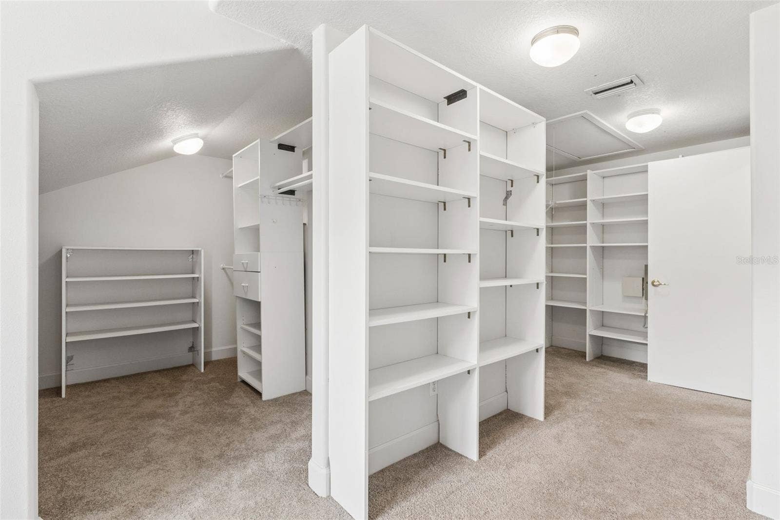 4301 DOWN POINT LANE, Windermere, FL 34786 Massive walk-in closet with custom built-in shelving off the primary suite.