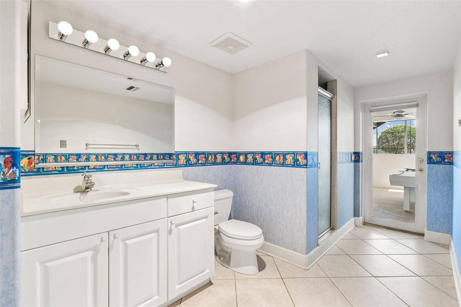 4301 DOWN POINT LANE, Windermere, FL 34786 Basement full bathroom with walk-out access to the pool deck.