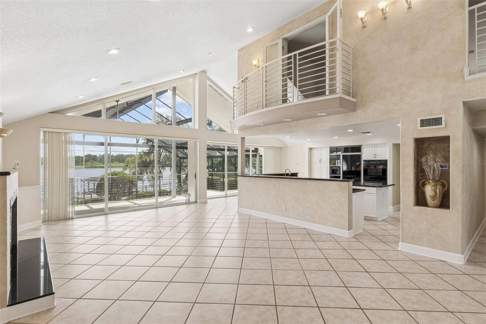 4301 DOWN POINT LANE, Windermere, FL 34786 Living Room overlooking the kitchen, and office above