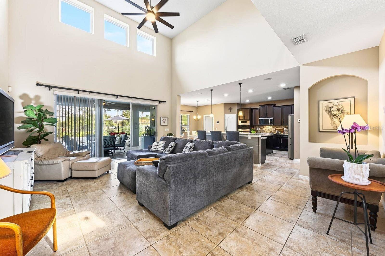 Natural light pours into the two story family room.