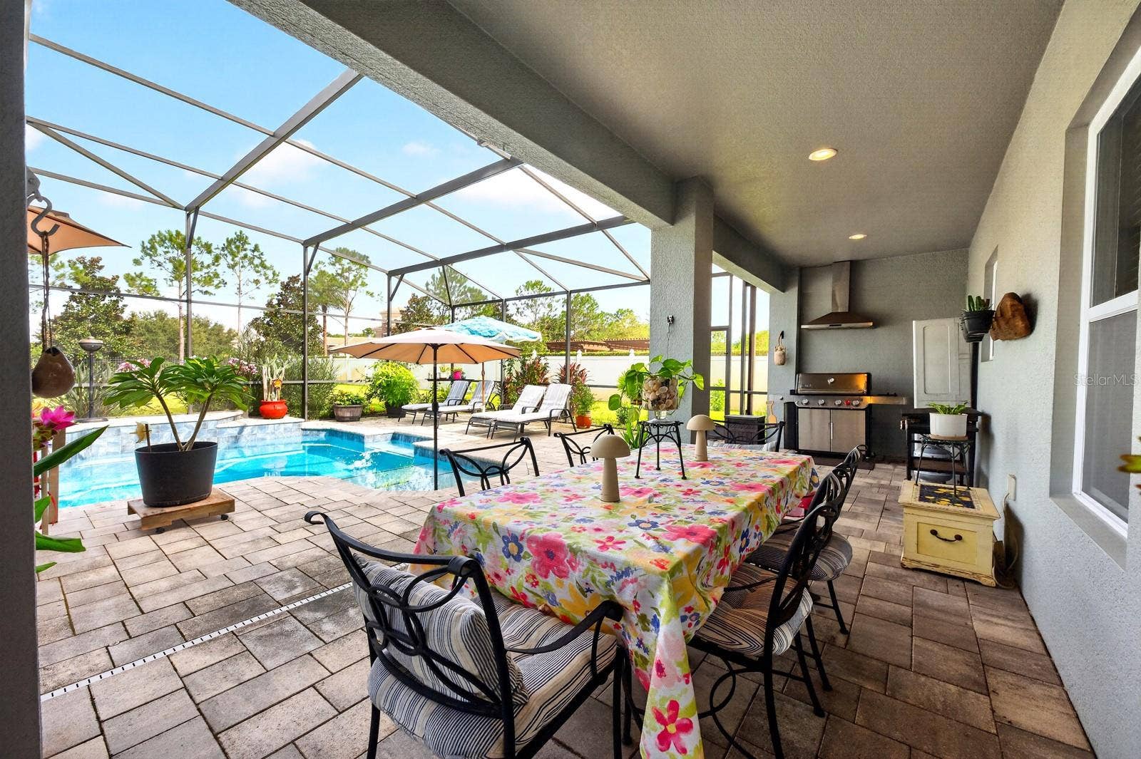 The covered lanai has an area for a summer kitchen.