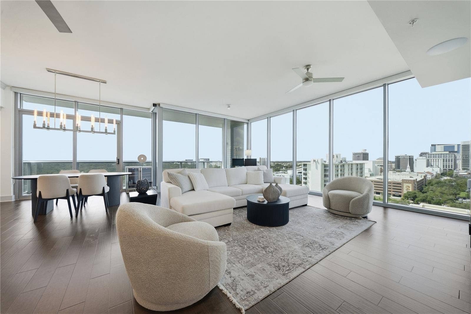 260 S OSCEOLA AVENUE, #1406, Orlando, FL 32801 14th-Floor Corner Residence | Living and dining wrapped in 10-Foot Floor-to-Ceiling glass