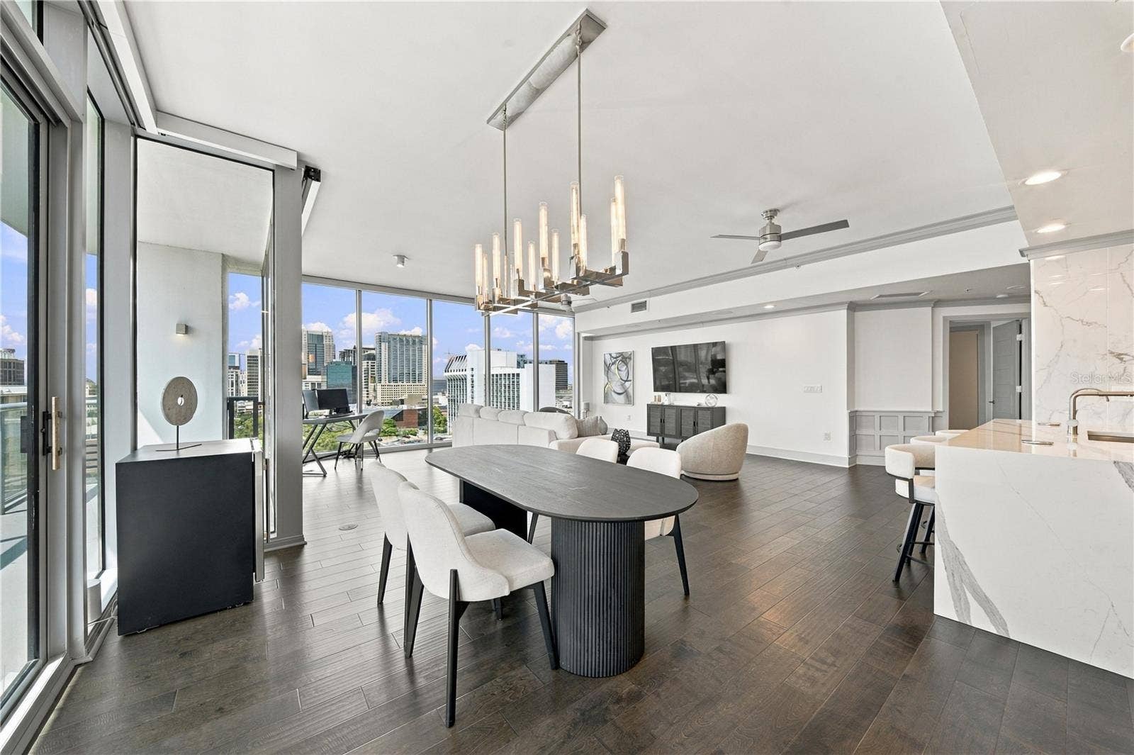 260 S OSCEOLA AVENUE, #1406, Orlando, FL 32801 Dining has panoramic city views for entertaining guests.