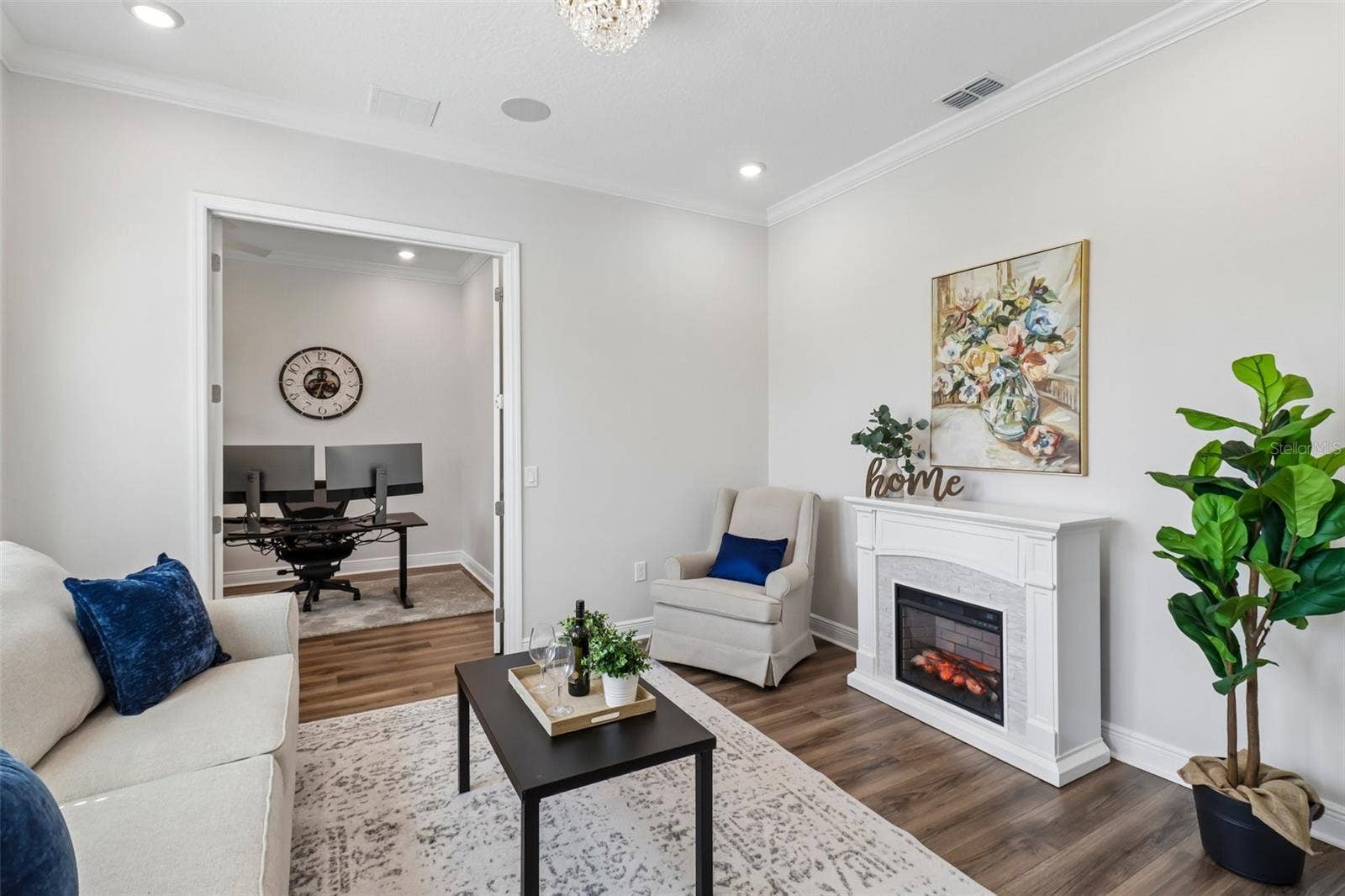 1257 WADING WATERS CIRCLE, Winter Park, FL 32792 Formal living room with a fireplace
