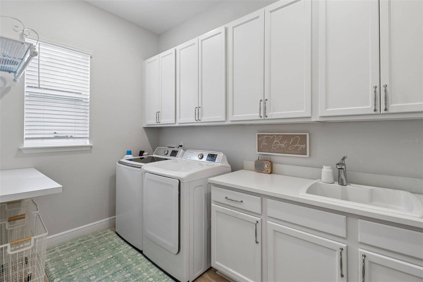 1257 WADING WATERS CIRCLE, Winter Park, FL 32792 Huge interior laundry room with a utility sink & extra cabinet & counter space