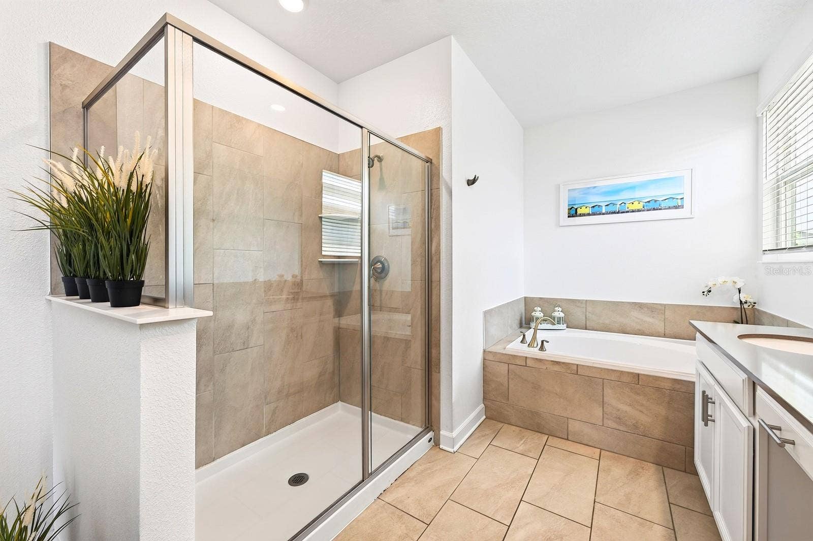 1045 LEADER STREET, Davenport, FL 33896 The Primary private en-suite bath boasts dual sinks, a GARDEN TUB, step-in shower, and private water closet.