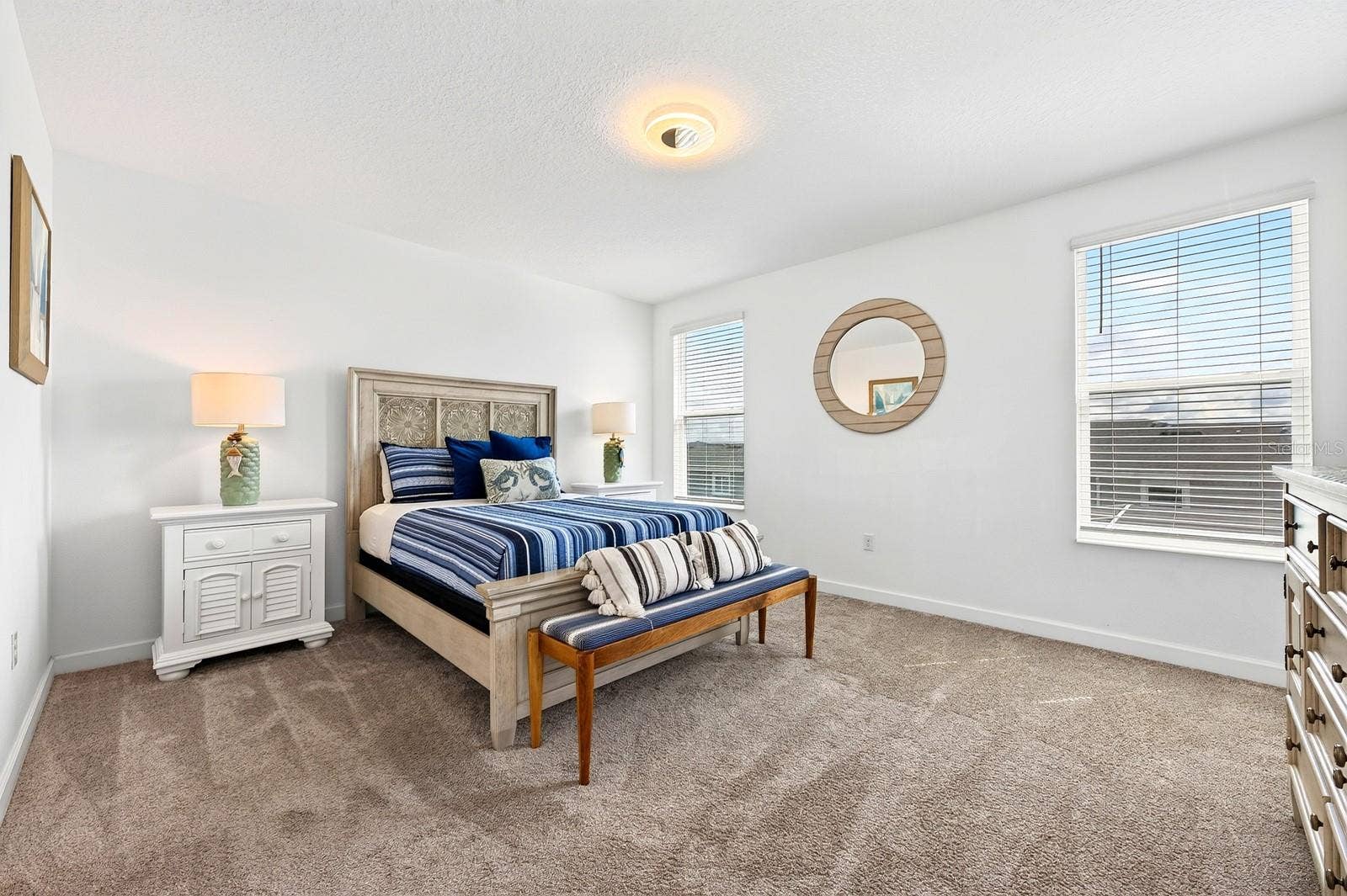 1045 LEADER STREET, Davenport, FL 33896 The generous PRIMARY SUITE is filled with NATURAL LIGHT and offers a WALK-IN CLOSET and private en-suite bath.