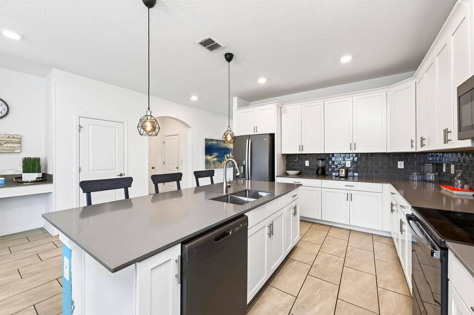 1045 LEADER STREET, Davenport, FL 33896 A generous center island offers extra prep space and room for counter-height seating.