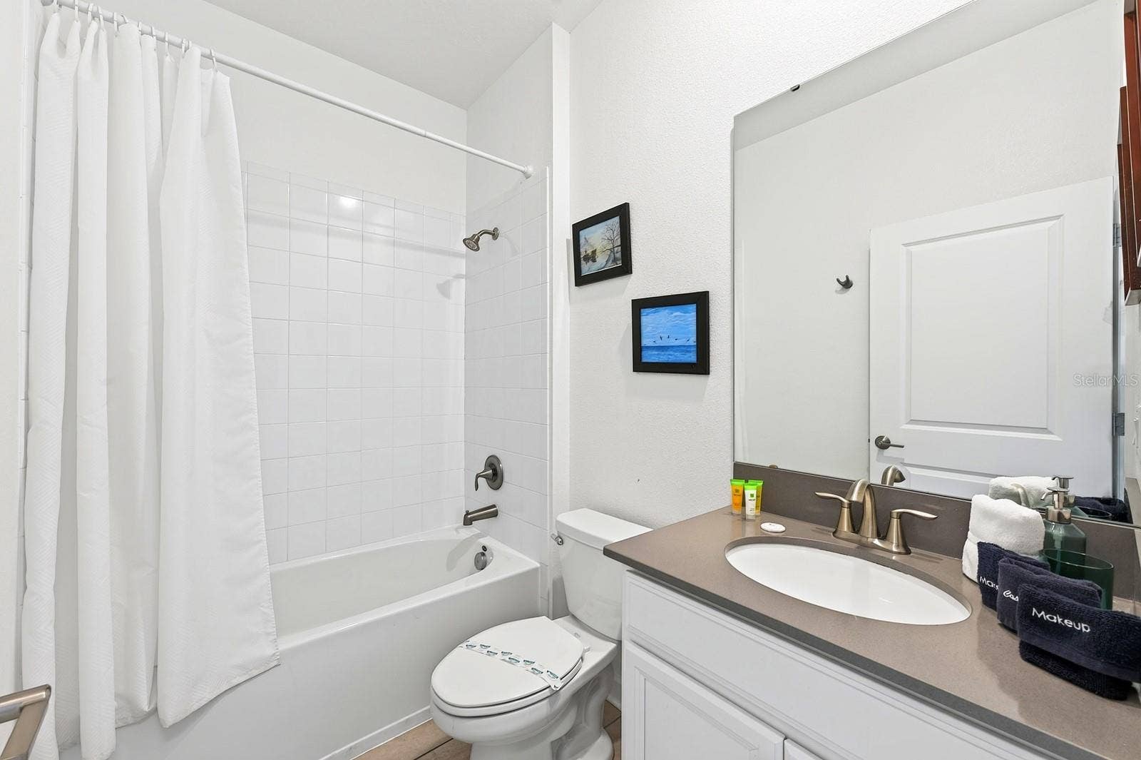 1045 LEADER STREET, Davenport, FL 33896 The main floor also offers a BEDROOM and FULL BATH, providing an ideal option for guests, extended family or MULTIGENERATIONAL LIVING.