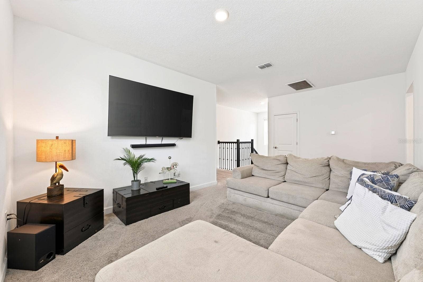 1045 LEADER STREET, Davenport, FL 33896 A SPACIOUS LOFT at the top of the stairs provides an additional gathering area, game space or flexible retreat.