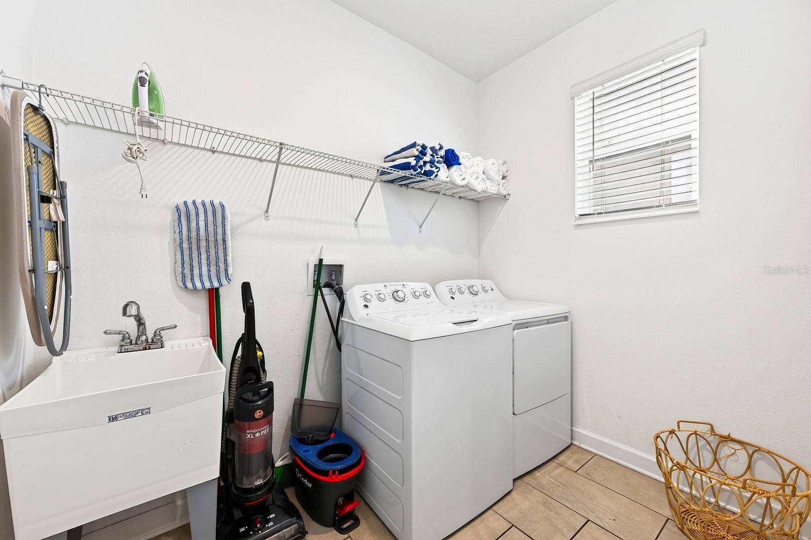1045 LEADER STREET, Davenport, FL 33896 A convenient Laundry Room with UTILITY TUB and INCLUDED WASHER AND DRYER completes the first floor.