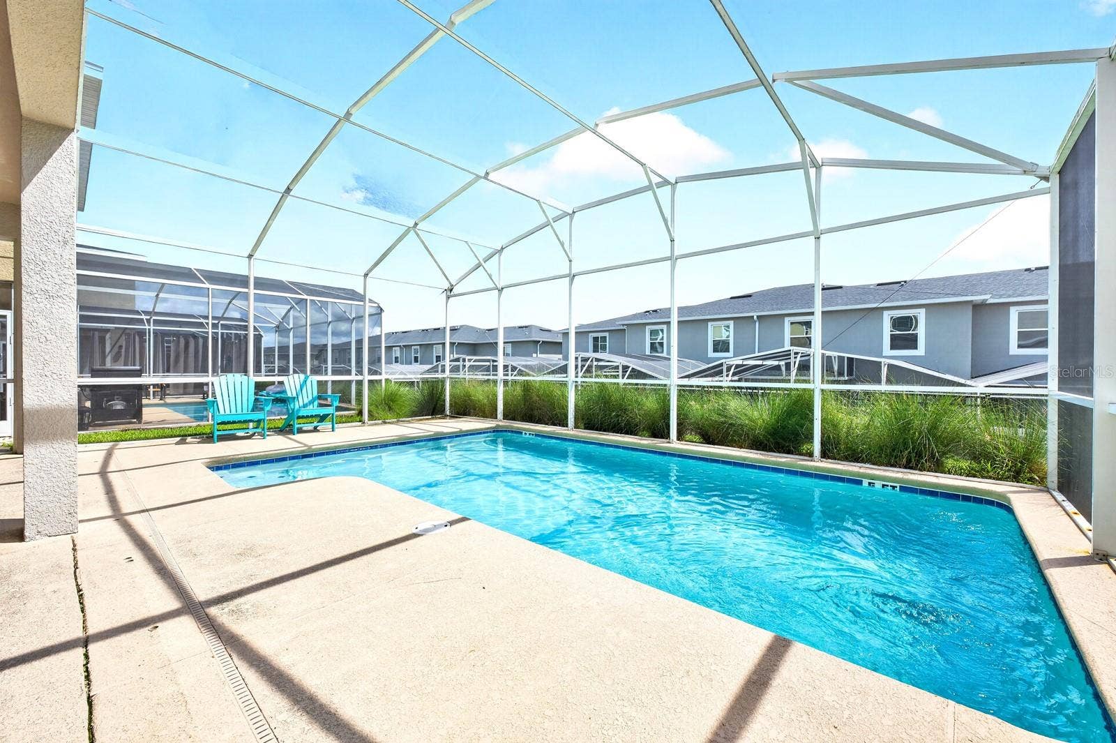 1045 LEADER STREET, Davenport, FL 33896 Outside, the PRIVATE POOL and covered patio under the SCREENED LANAI, create the perfect place to unwind after a day exploring Central Florida's attractions.