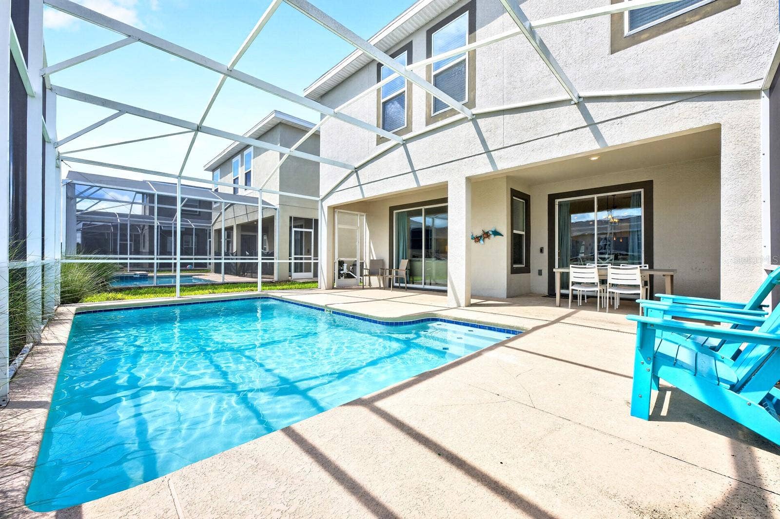 1045 LEADER STREET, Davenport, FL 33896 Sliding glass doors lead to your COVERED PATIO and PRIVATE POOL, all enclosed within a SCREENED LANAI.