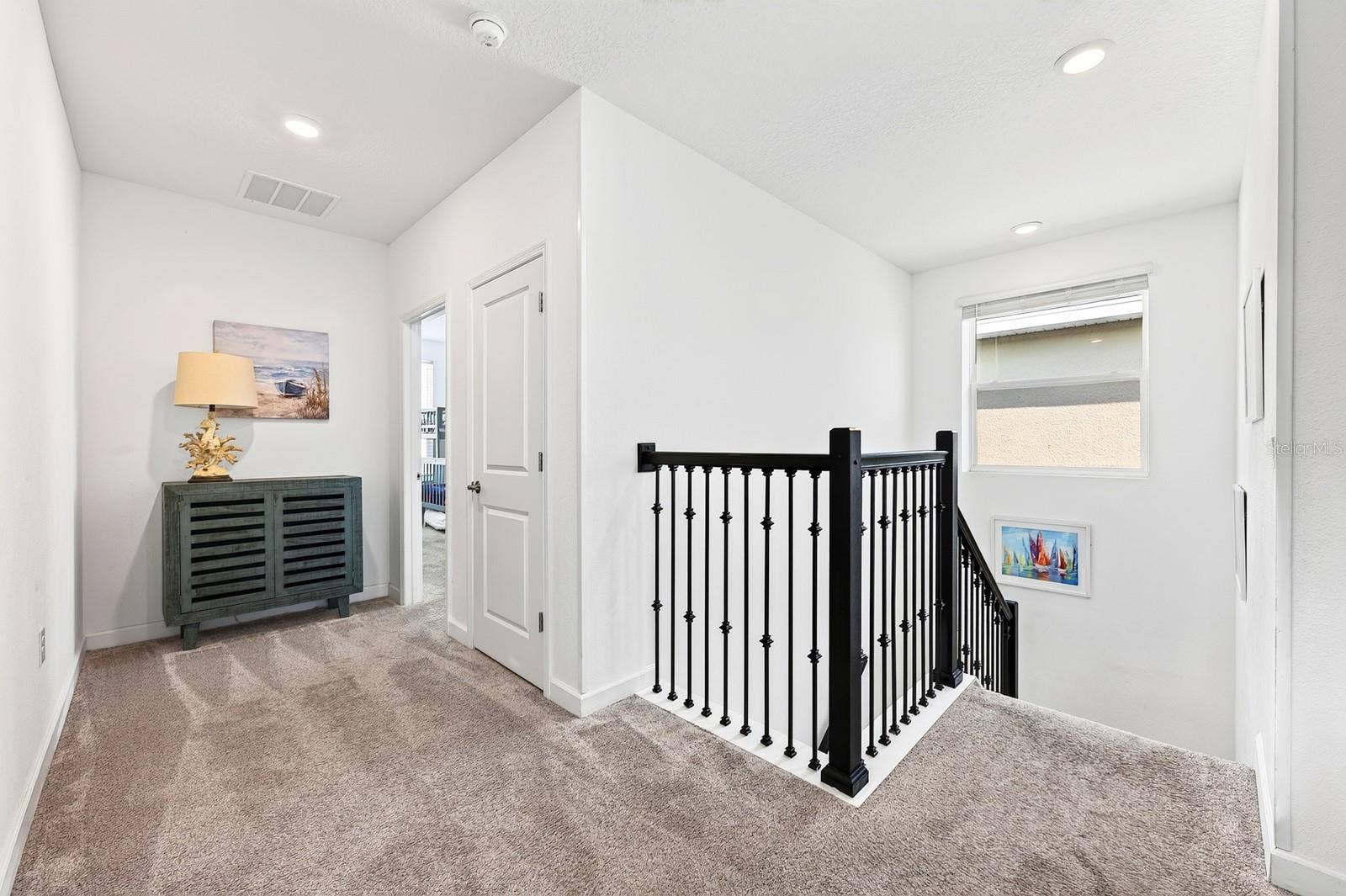 1045 LEADER STREET, Davenport, FL 33896 Upstairs, plush CARPETING continues throughout.