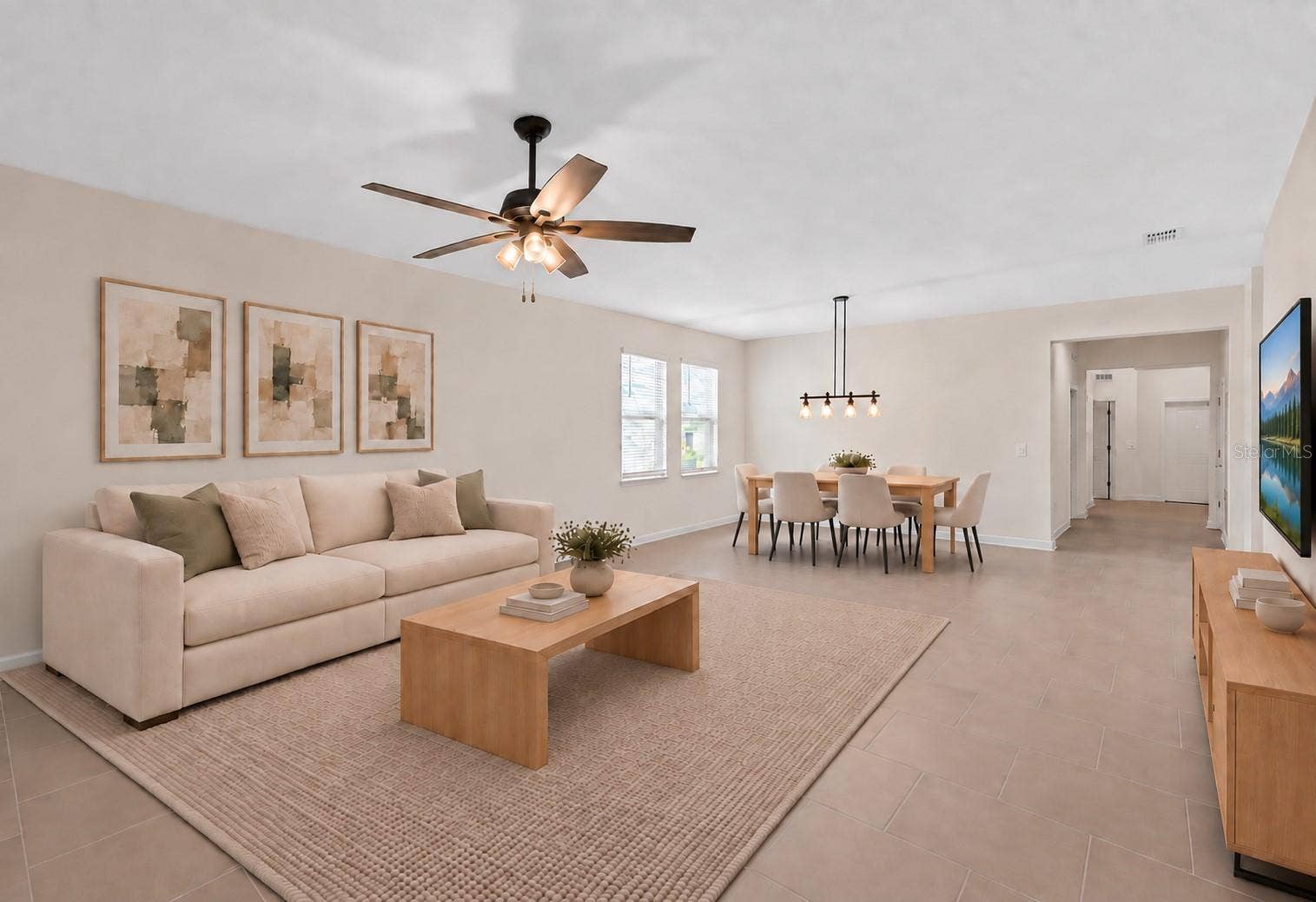 1874 FLOURISH AVENUE, Kissimmee, FL 34744 The dining and living spaces flow together beautifully, creating plenty of room for both everyday living and entertaining.