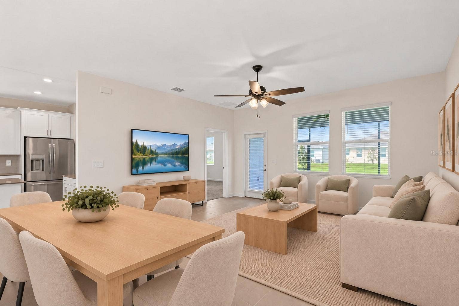 1874 FLOURISH AVENUE, Kissimmee, FL 34744 The dining and living spaces flow together beautifully, creating plenty of room for both everyday living and entertaining.