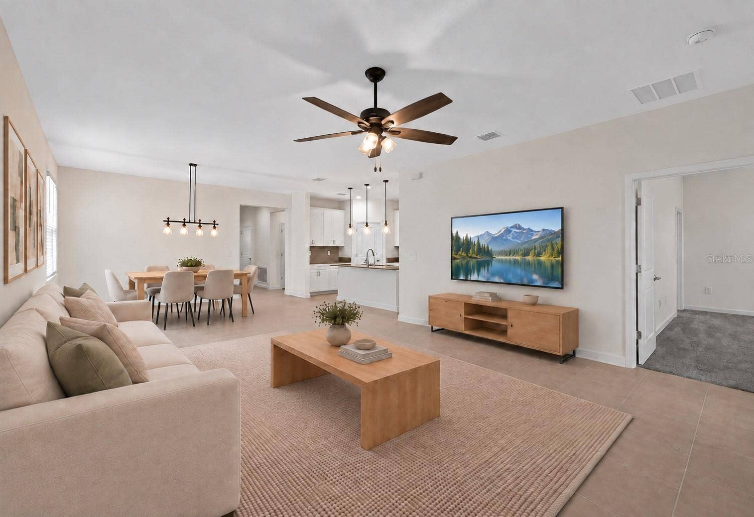 1874 FLOURISH AVENUE, Kissimmee, FL 34744 The open kitchen, dining and living spaces flow together beautifully, creating plenty of room for both everyday living and entertaining.