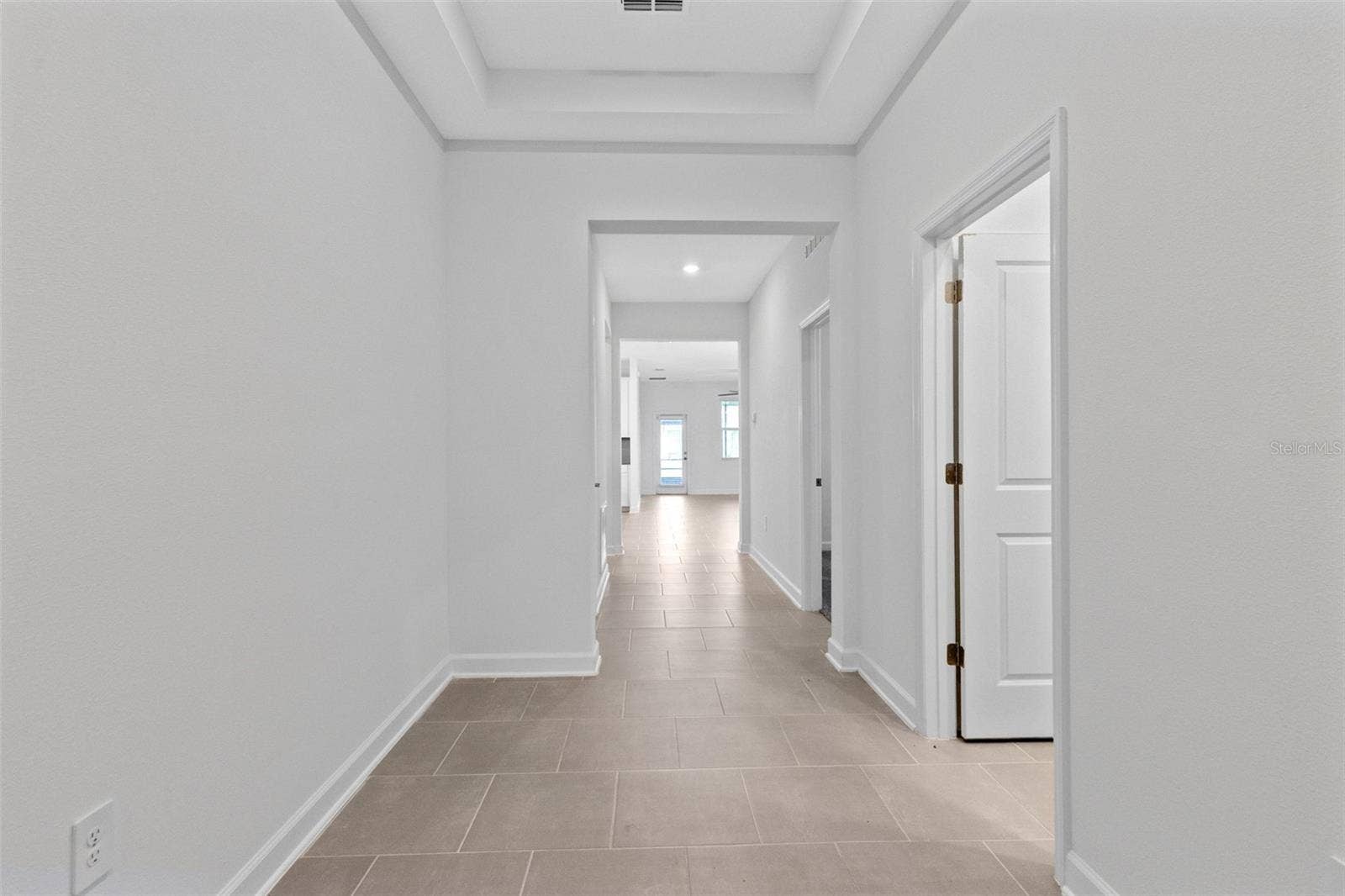 1874 FLOURISH AVENUE, Kissimmee, FL 34744 Step inside to a light and welcoming interior featuring high ceilings, a fresh neutral palette and ceramic tile throughout the main living areas.