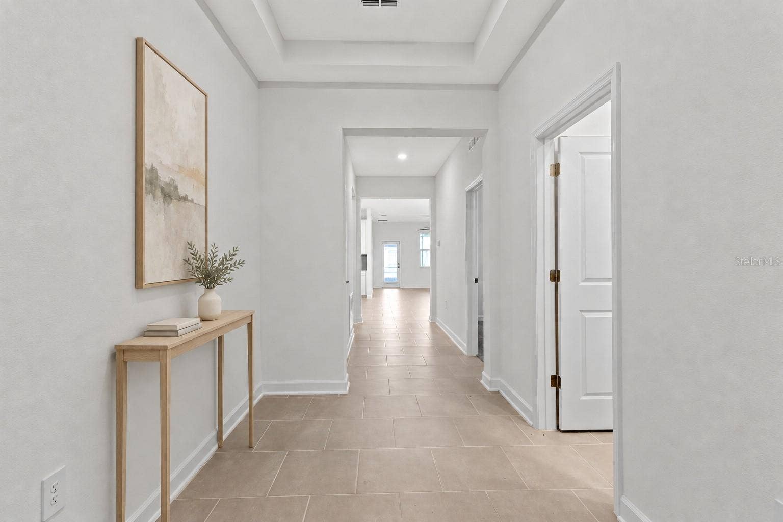 1874 FLOURISH AVENUE, Kissimmee, FL 34744 Step inside to a light and welcoming interior featuring high ceilings, a fresh neutral palette and ceramic tile throughout the main living areas.