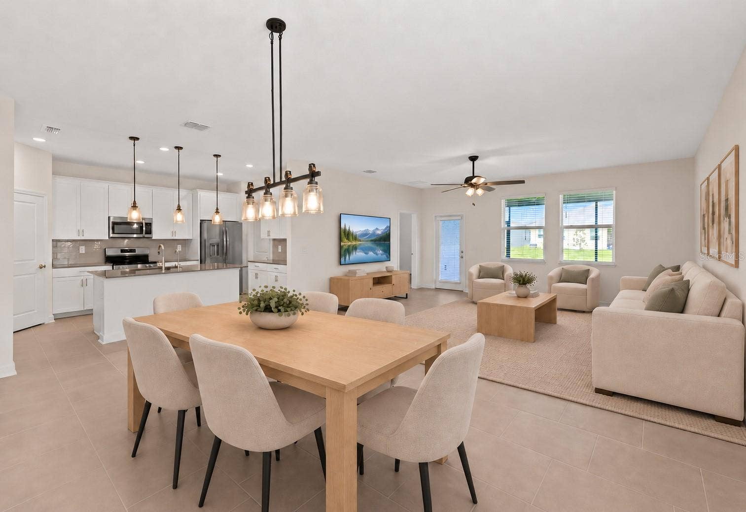 1874 FLOURISH AVENUE, Kissimmee, FL 34744 Dining room overlooking kitchen and living room.